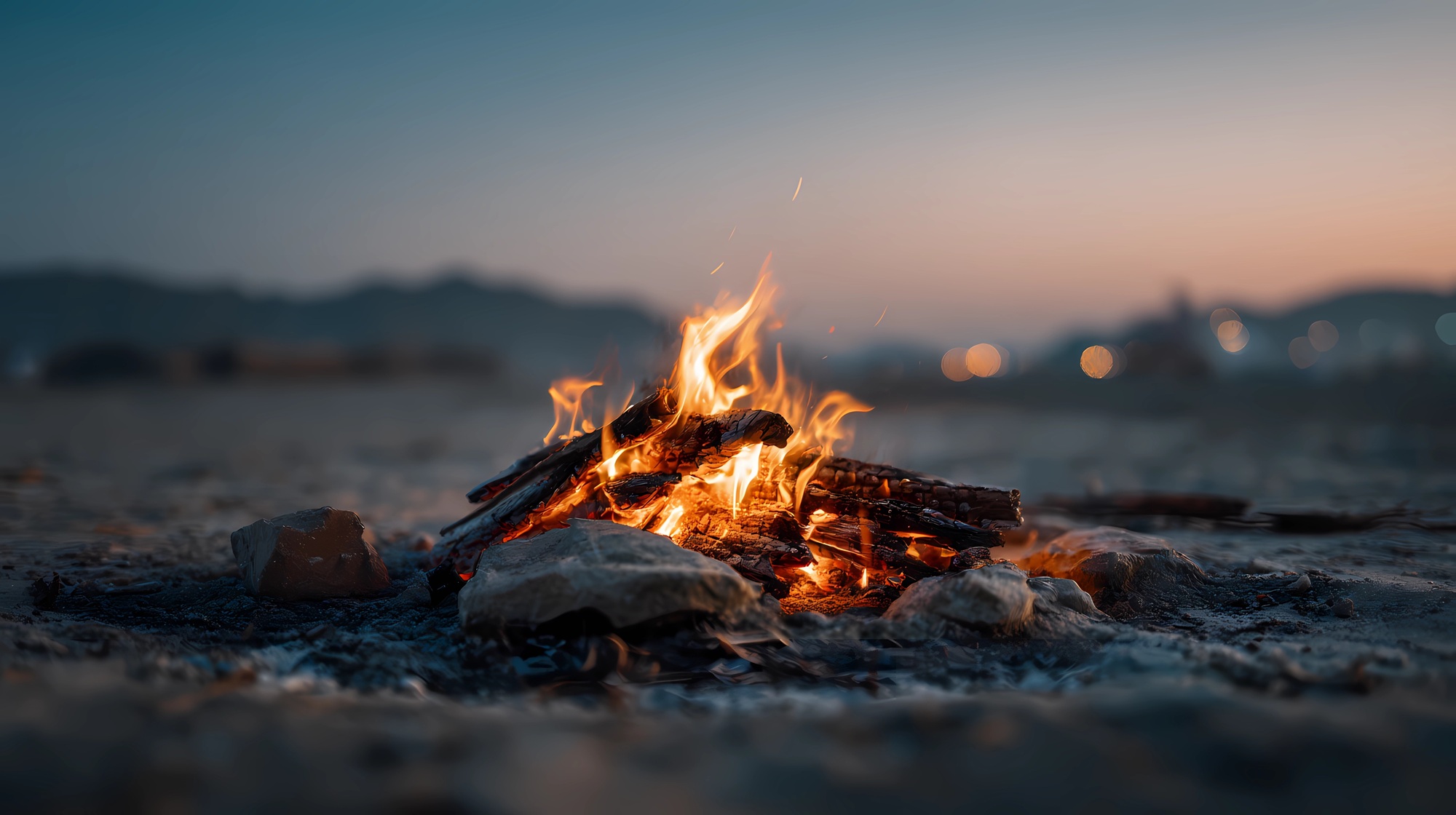 Solitary fire composition in an empty setting, focusing on warmth, nature, and outdoor experience.